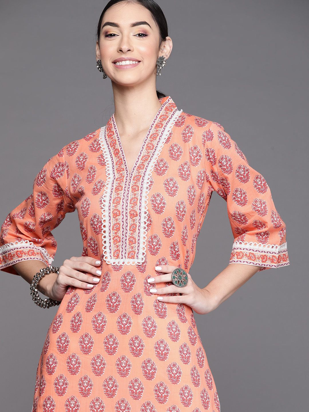 Libas Women Peach Orange Floral Print V-Neck Flared Sleeves Laces Pure Cotton Kurta Price in India