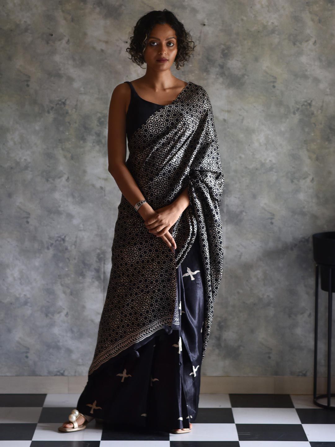 Suta Black & Off White Floral Printed Saree Price in India