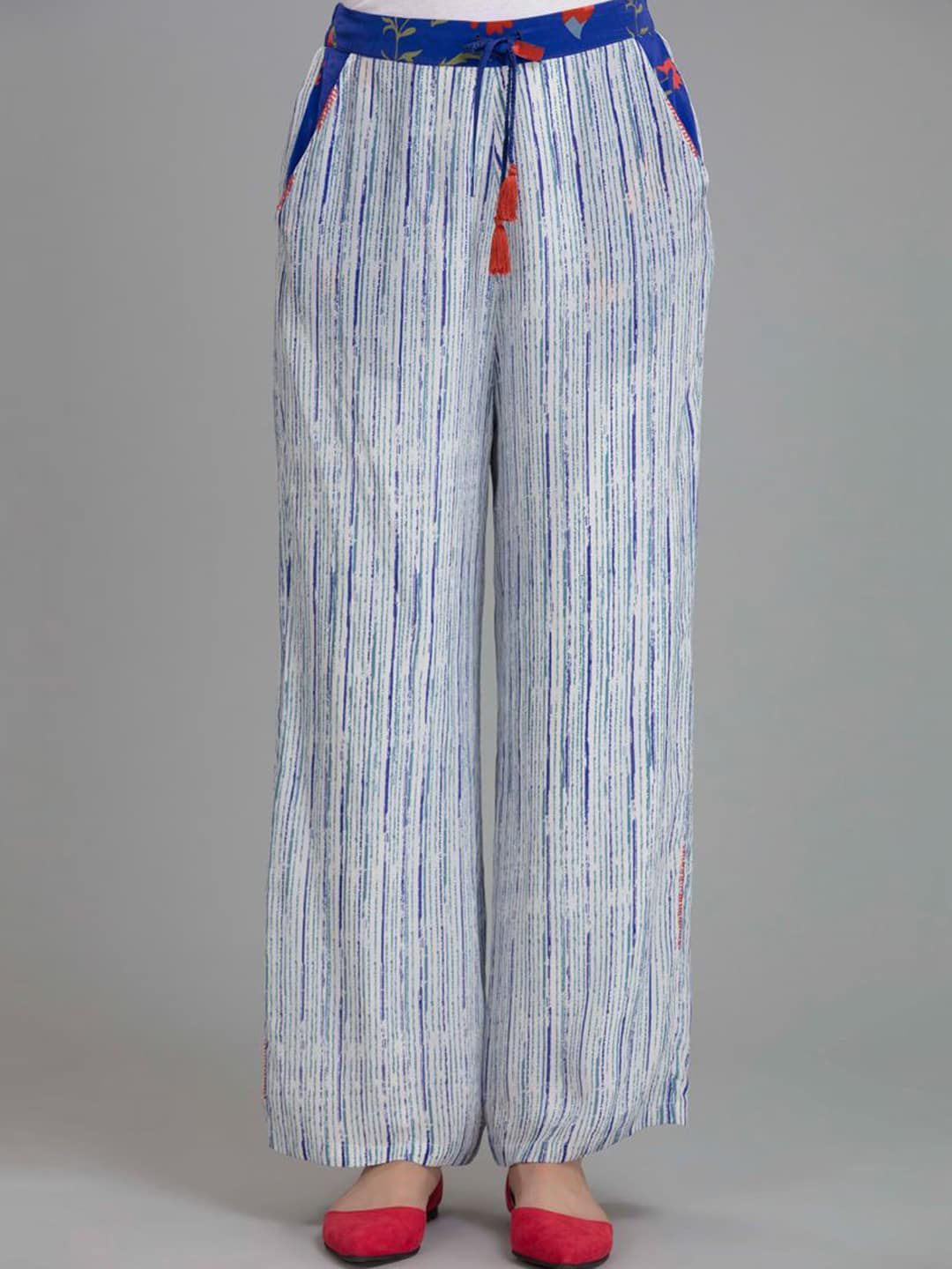 SHAYE Women White & Blue Striped Relaxed Parallel Trousers Price in India