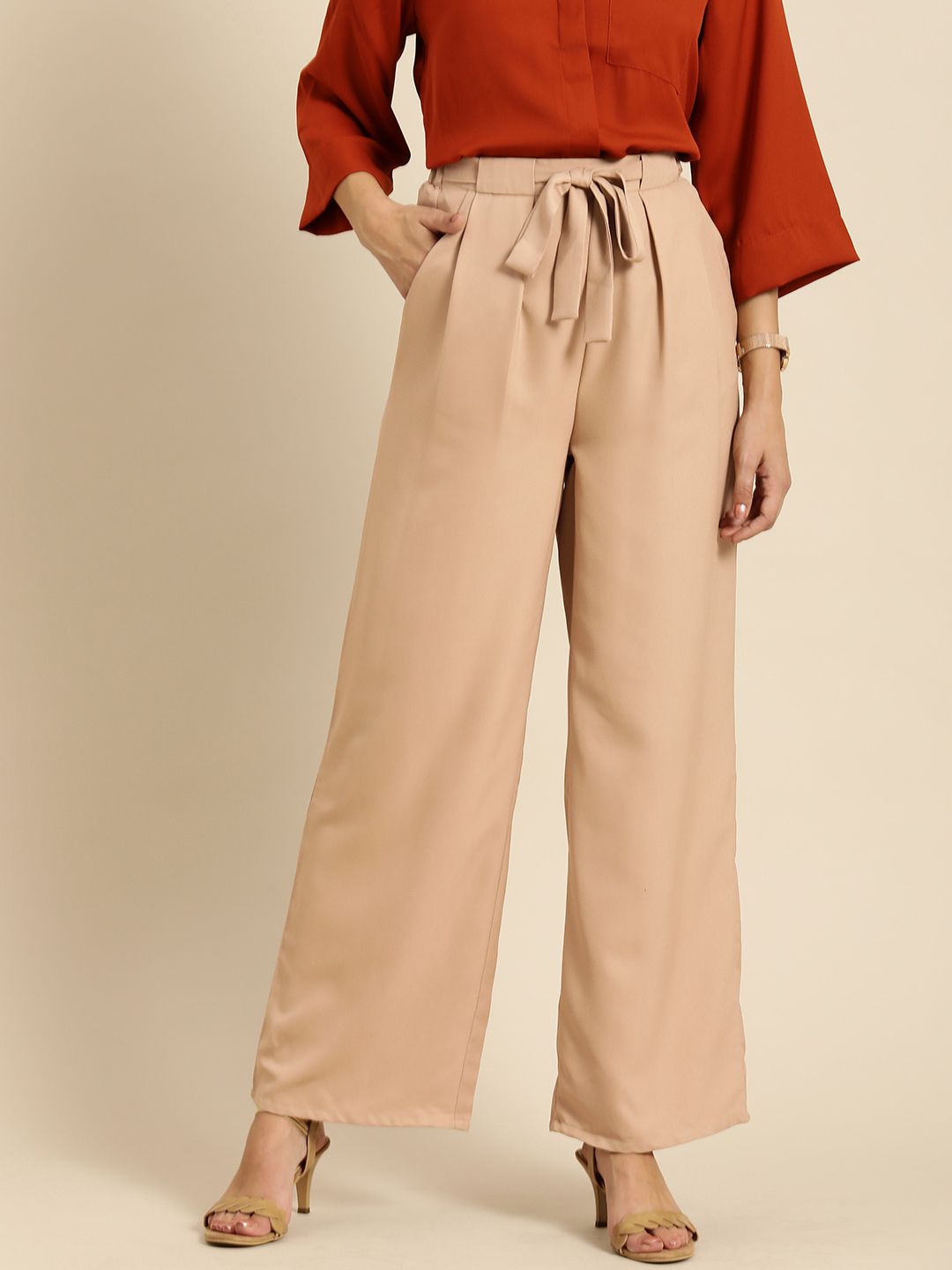 all about you Women Beige Solid Mid-Rise Regular Trousers Price in India
