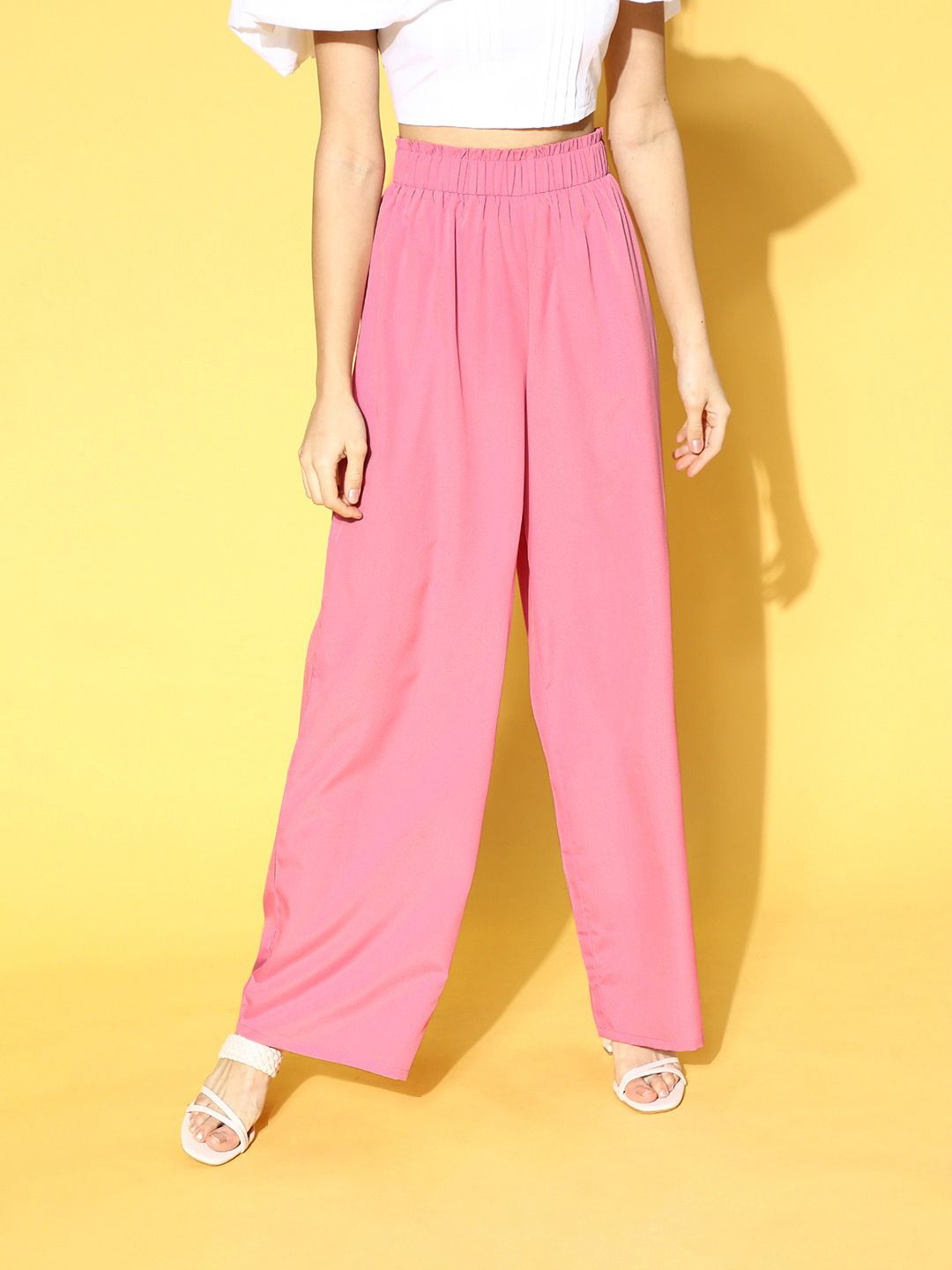 Berrylush Women Pretty Pink Solid Kick Flare Trousers Price in India