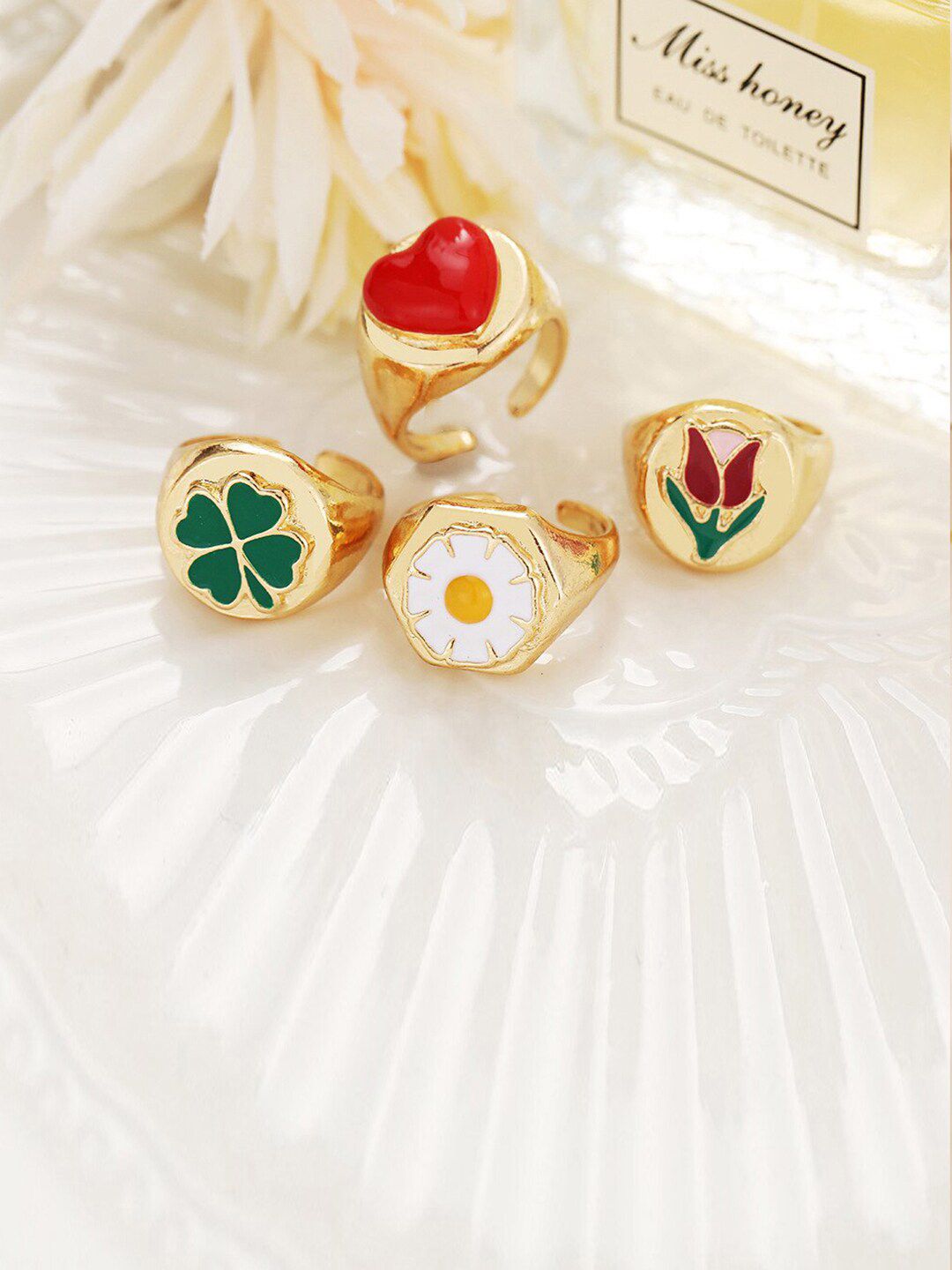 Jewels Galaxy Set Of 4 Gold-Plated & Green Design Detailed Finger Rings Price in India