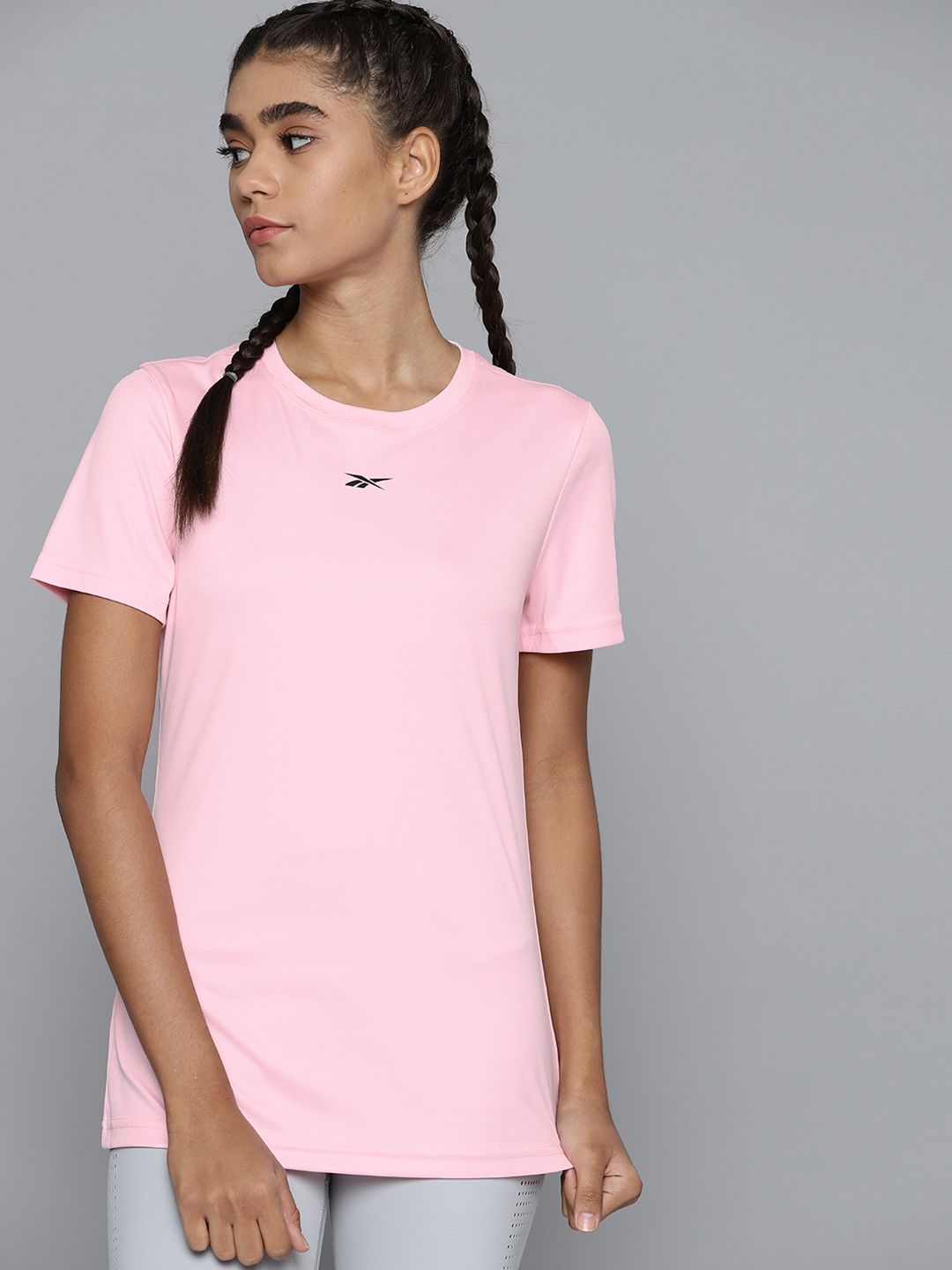 Reebok Women Pink Solid Training or Gym T-shirt Price in India