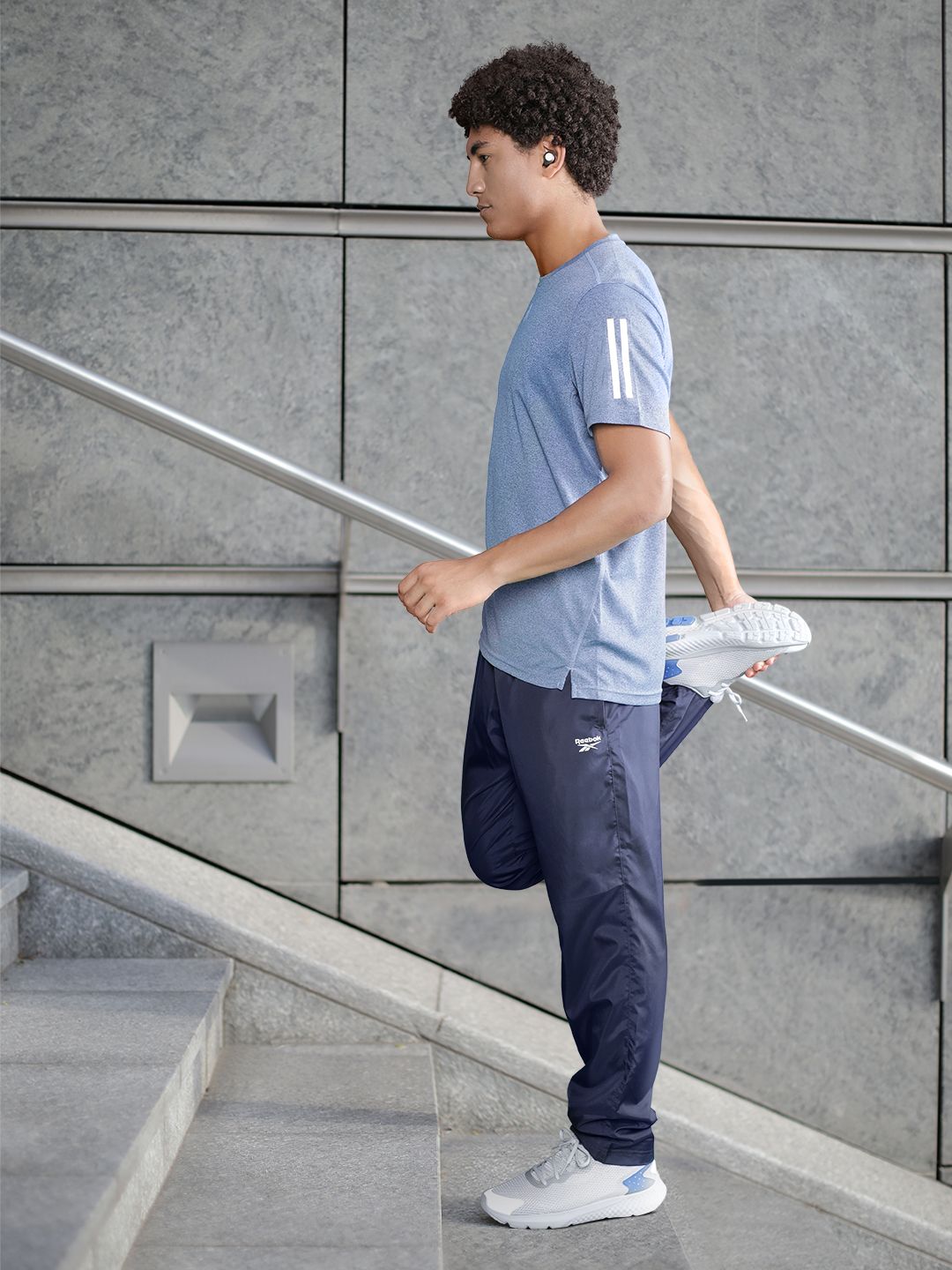 Buy Reebok Men Navy Blue Solid TE WVN OH Training Track Pants