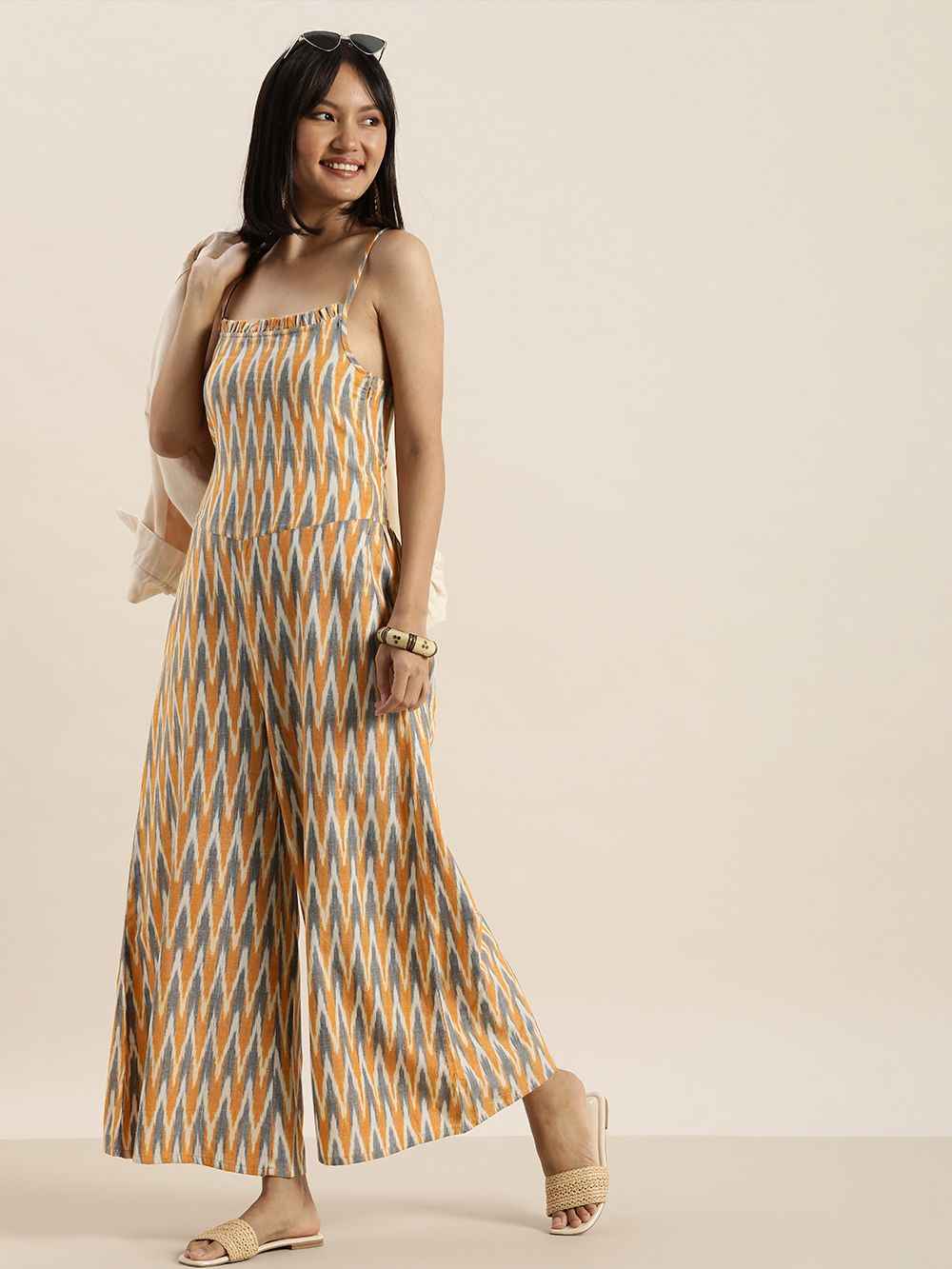 Taavi Women Mustard & Blue Ikat Printed Sleeveless Culotte Jumpsuit Price in India