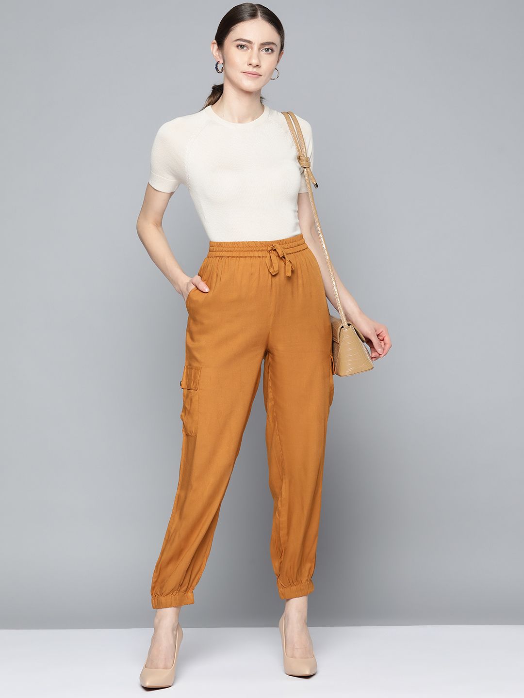 Chemistry Women Mustard Yellow Solid Cargos Trousers Price in India