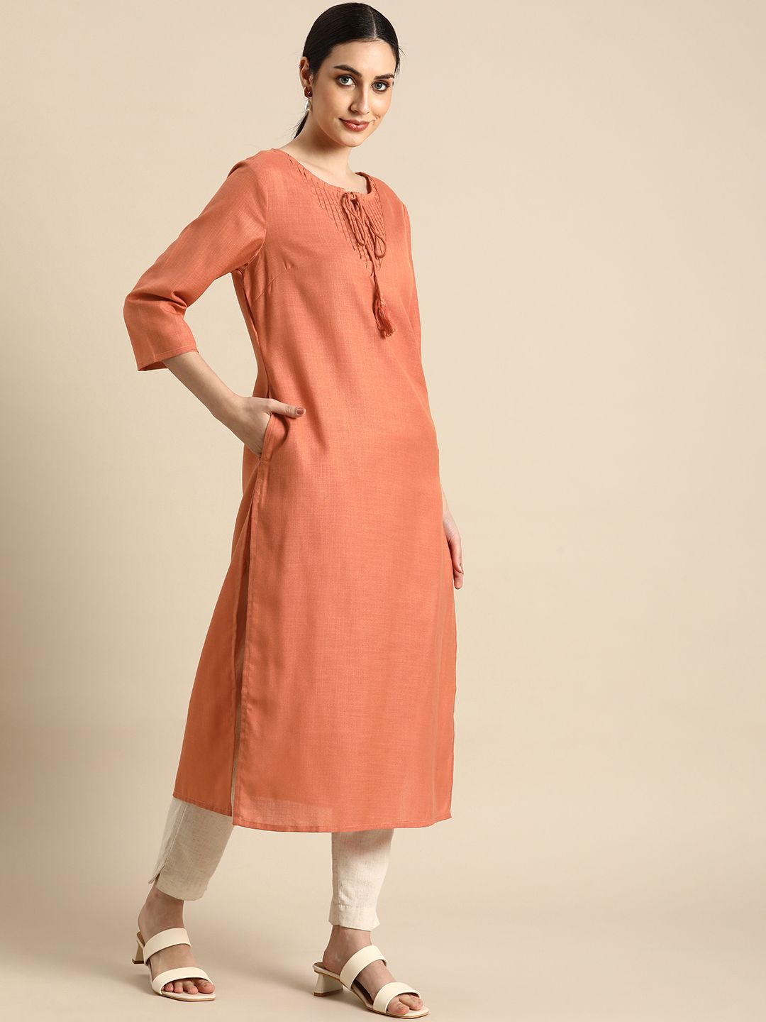 Anouk Women Peach-Coloured  Solid  Tie- Up Neck Kurta With Pleated Yoke Price in India
