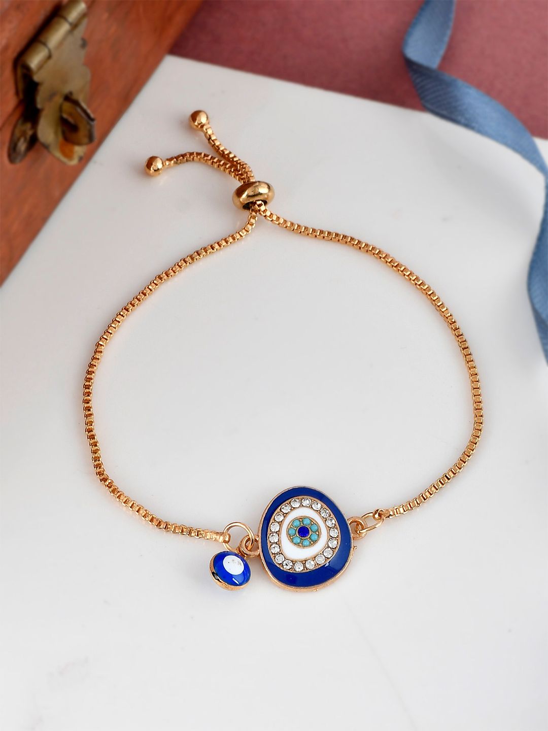 Shoshaa Women Gold-Toned & Blue Evil Eye Wraparound Bracelet Price in India