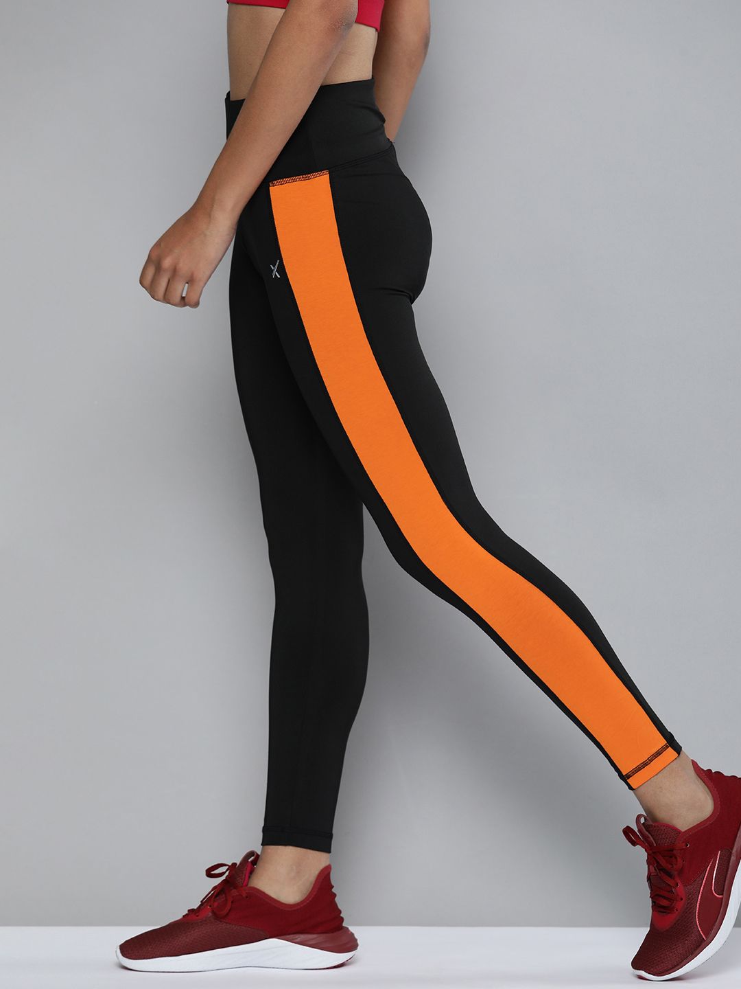 HRX by Hrithik Roshan Women Black & Orange Solid Running Tights Price in India