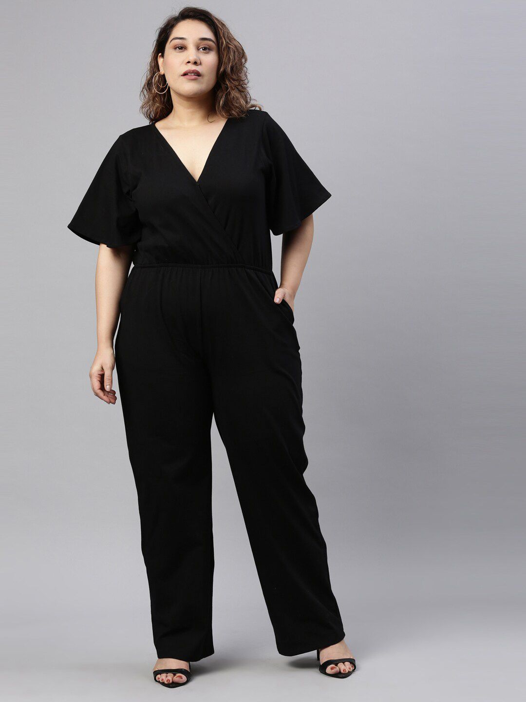 The Pink Moon Women Plus Size Black Solid Basic Jumpsuit Price in India