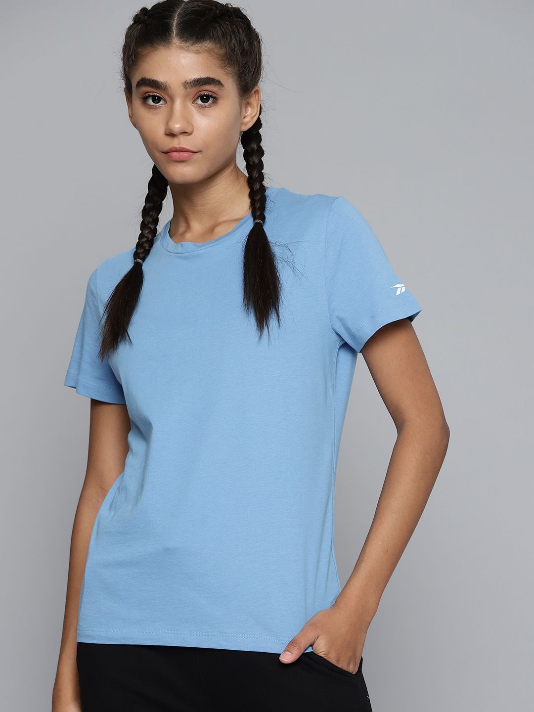 Reebok Women Blue Solid Training or Gym T-shirt Price in India