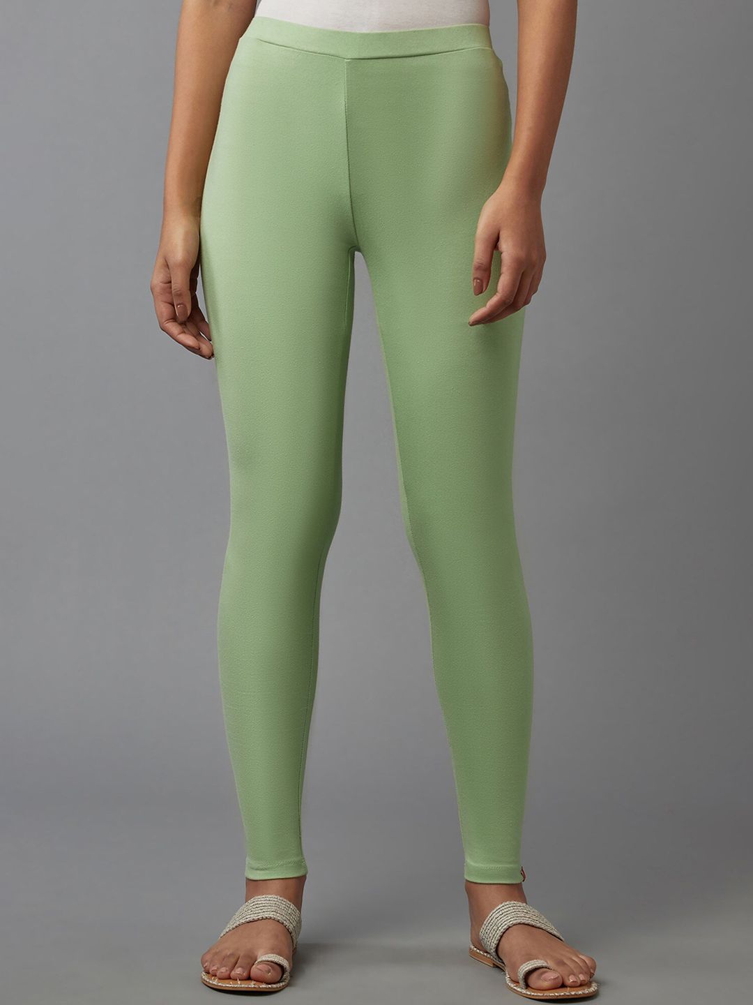 W Women Green Solid Mid Rise Ankle Length Leggings Price in India