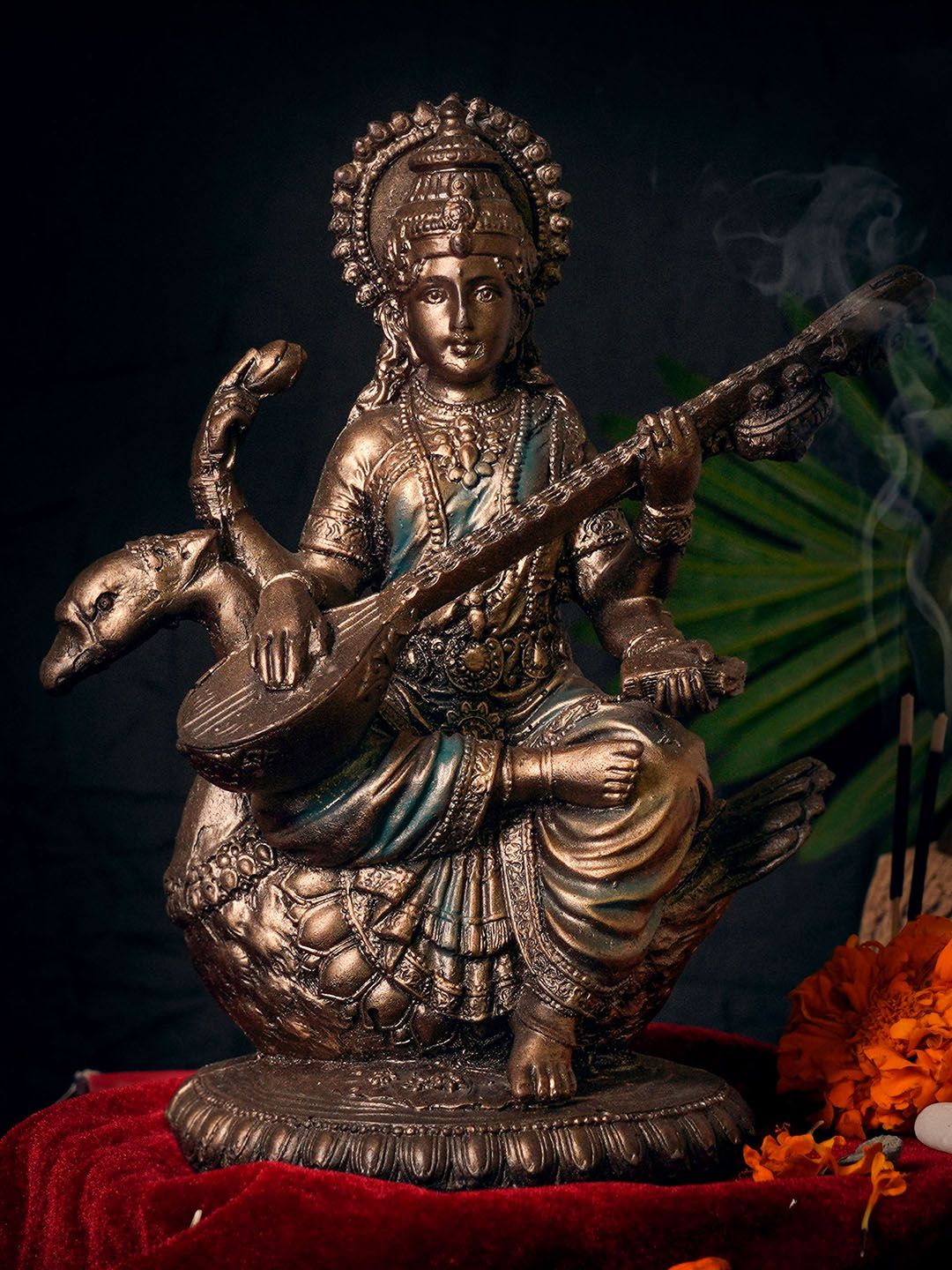 TIED RIBBONS Copper-Toned Maa Saraswati Idol Showpiece Price in India
