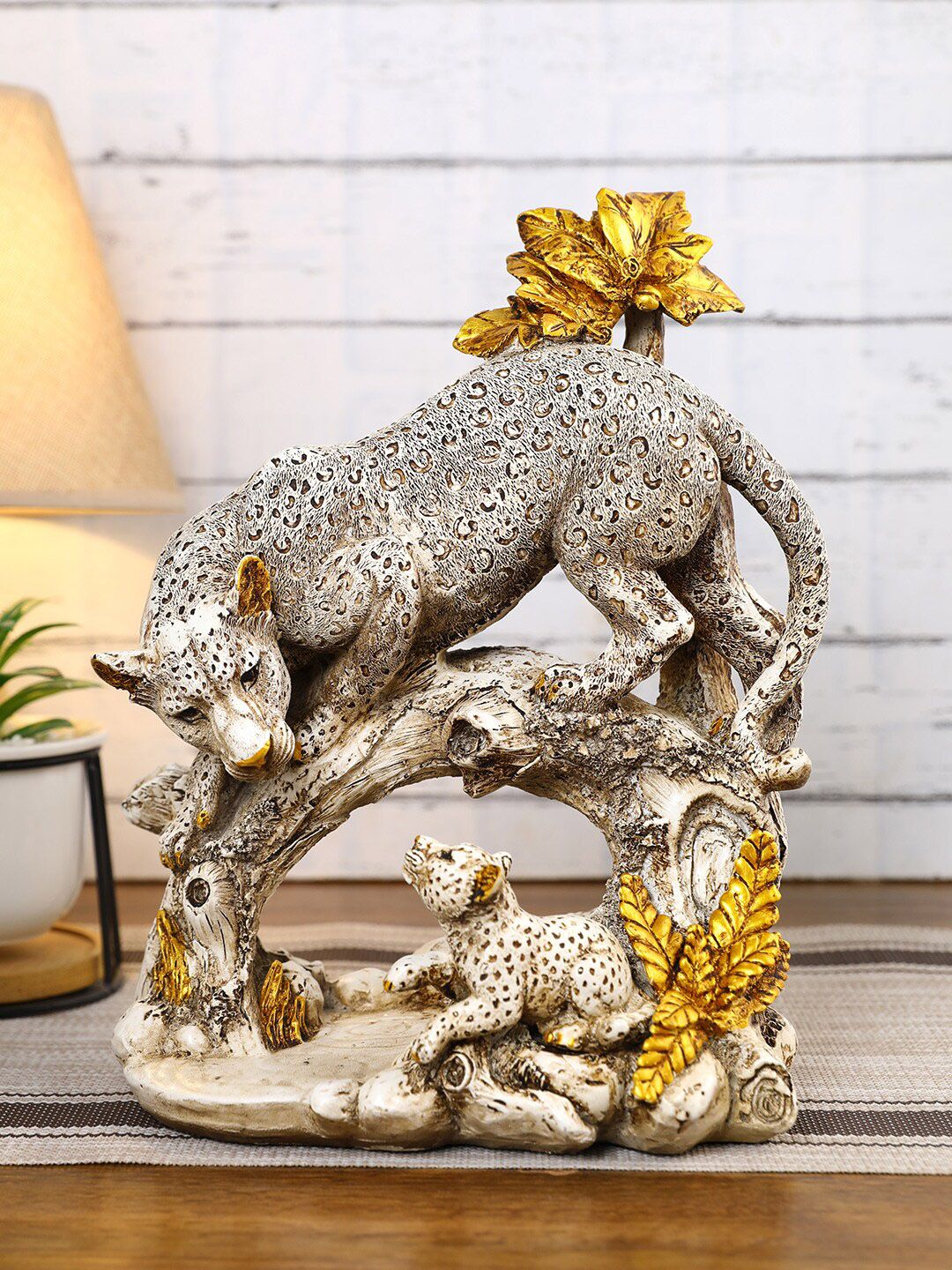 CraftVatika Cream & Yellow Panther Family Animal Showpiece Price in India