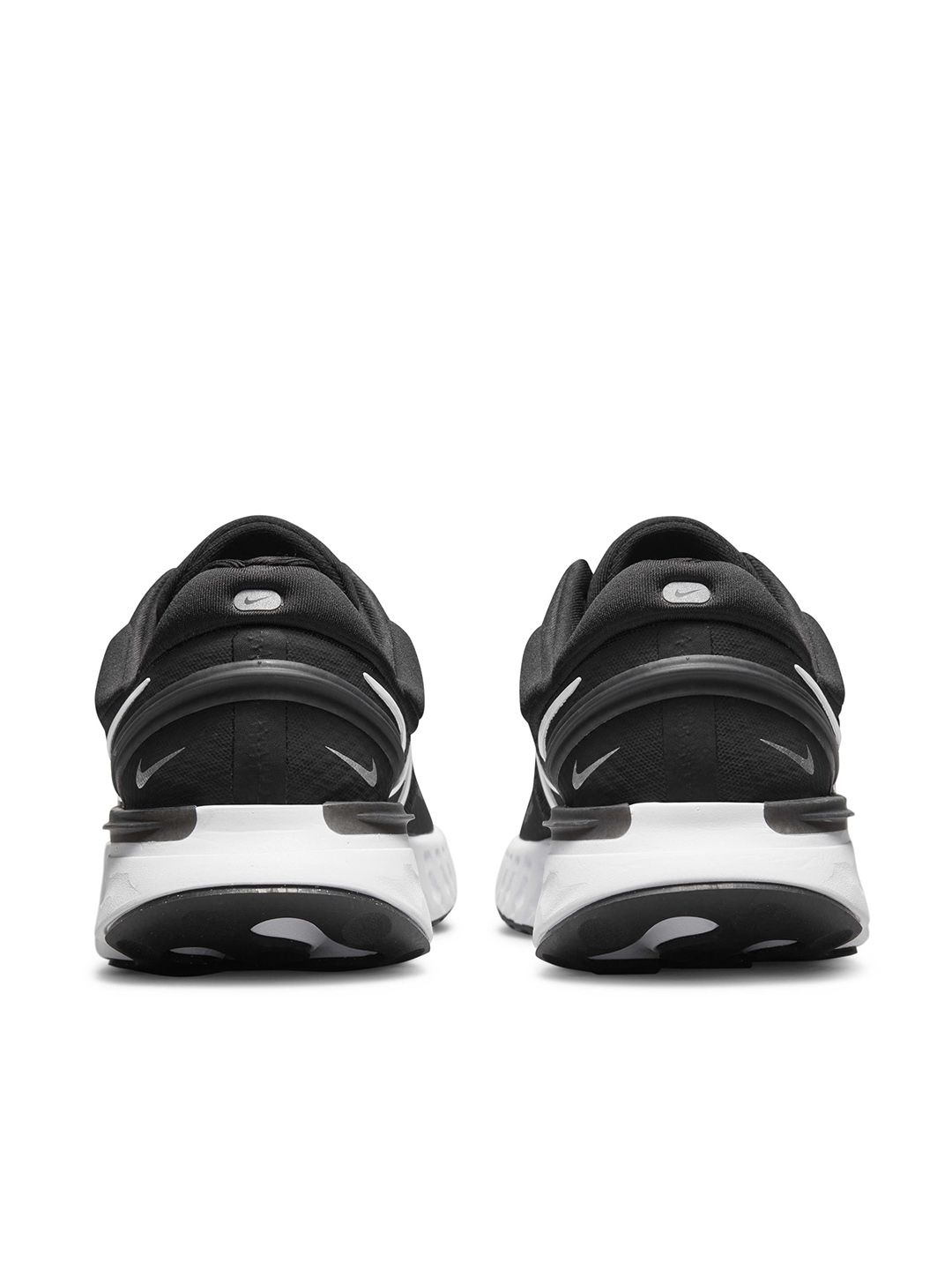 nike running react miler trainers in triple black