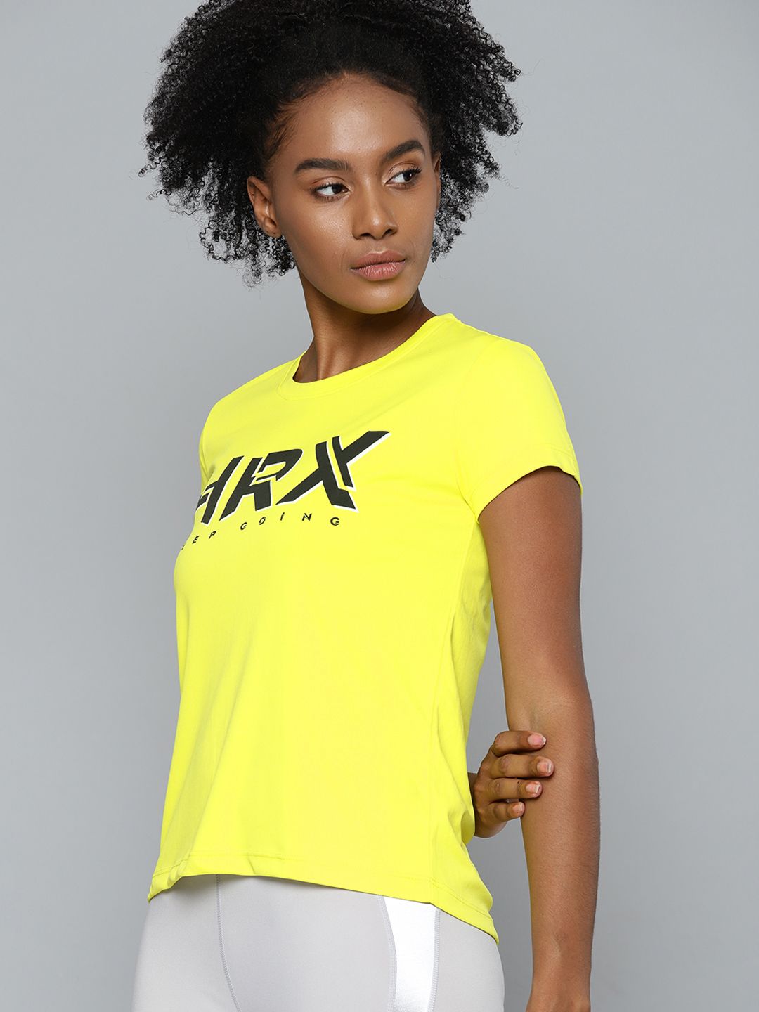 HRX By Hrithik Roshan Training Women Neon Lime Rapid-Dry Brand Carrier Tshirts Price in India