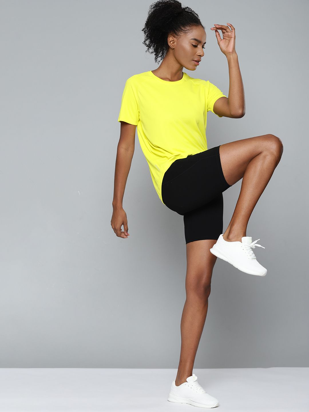 HRX By Hrithik Roshan Training Women Neon Lime Rapid-Dry Solid Tshirts Price in India