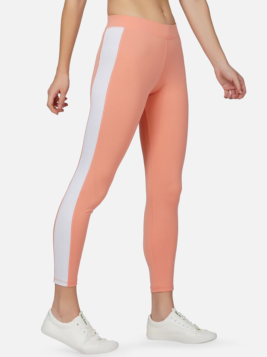 IMPERATIVE Women Peach Pink & White Solid Slim Fit Dry Fit Yoga Tights with Side Taping Price in India