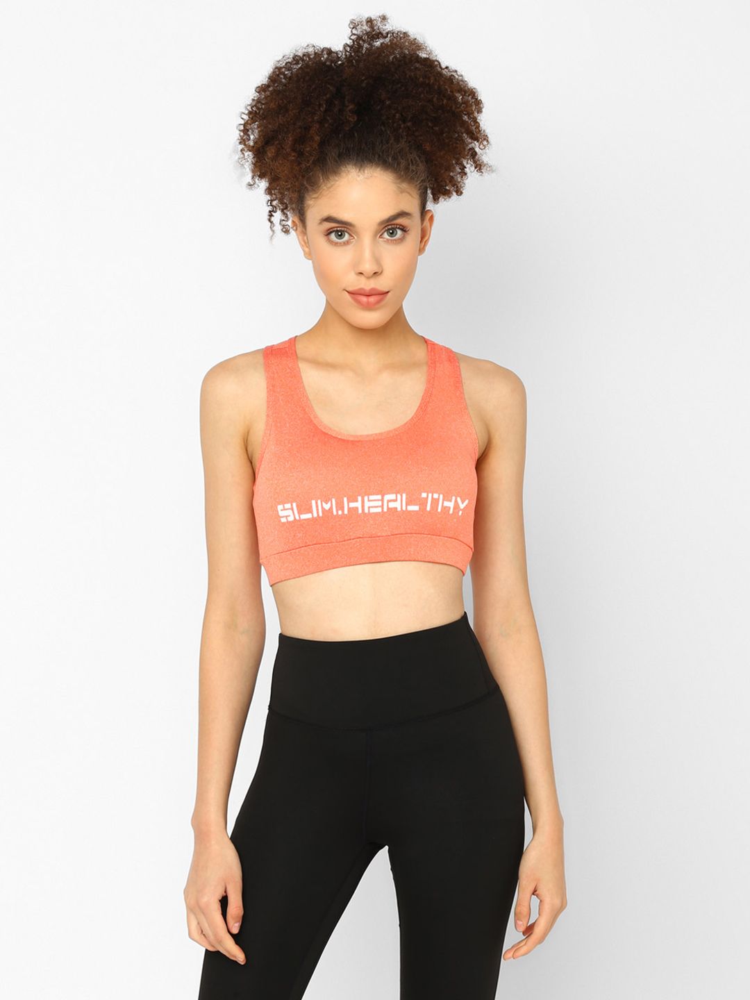 JerfSports Coral Orange Typography Sports Bra With Melange Effect Price in India