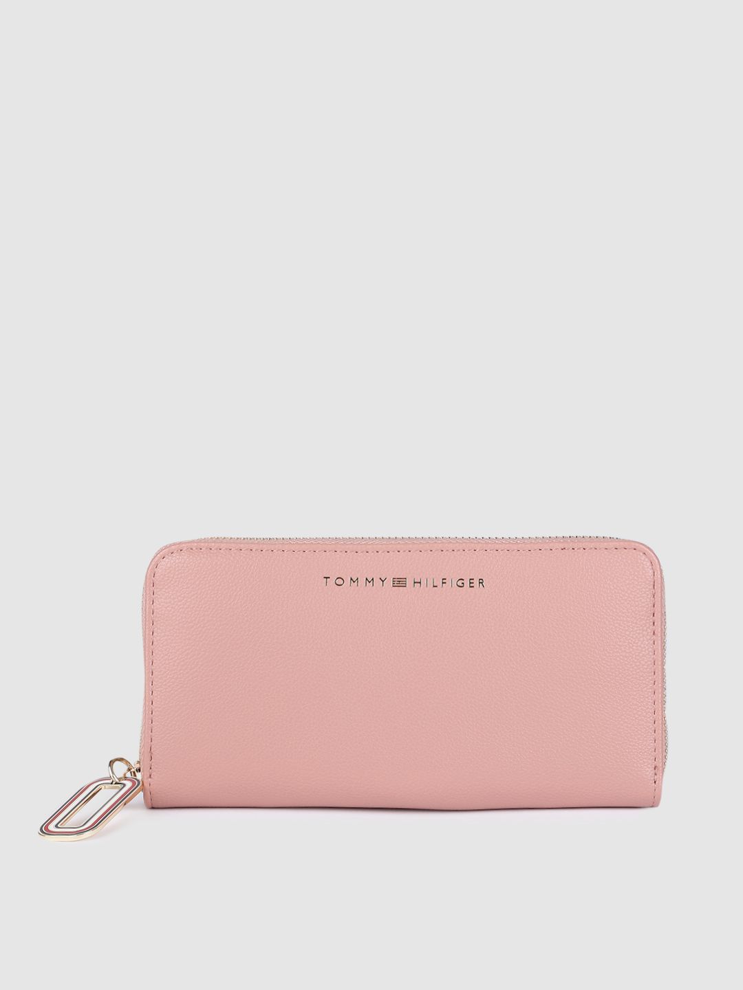 Tommy Hilfiger Women Salmon Pink Solid PU Zip Around Wallet with Brand Logo Tassel Price in India