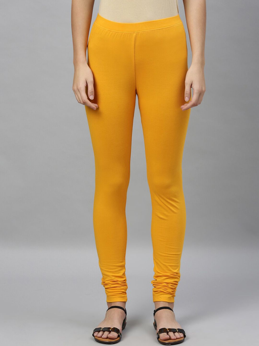 Kryptic Women Yellow Solid Churidar Length Leggings Price in India