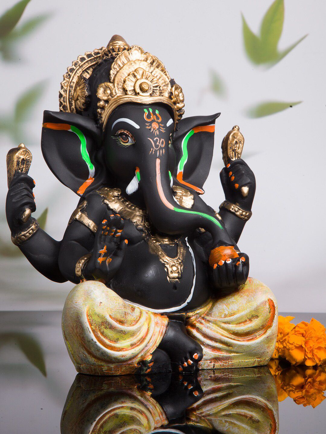 KLOTTHE Black & Gold-Toned Polyresin Ganesha Idol Showpiece Price in India
