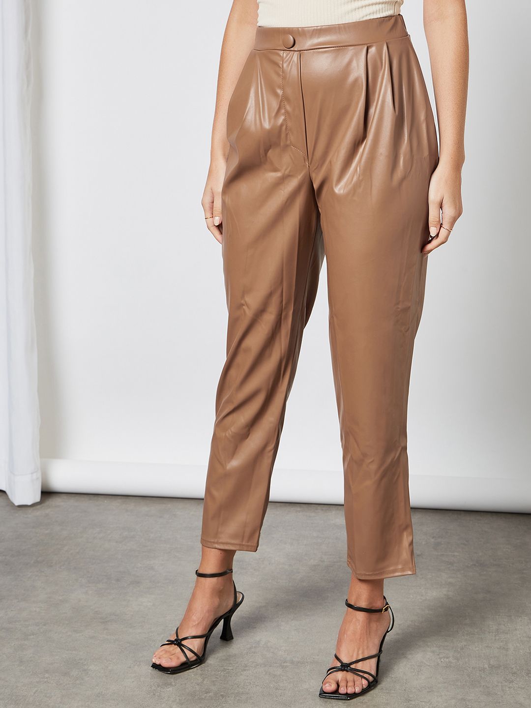 Femme Luxe Women Brown Solid PU Coated Pleated Trousers Price in India