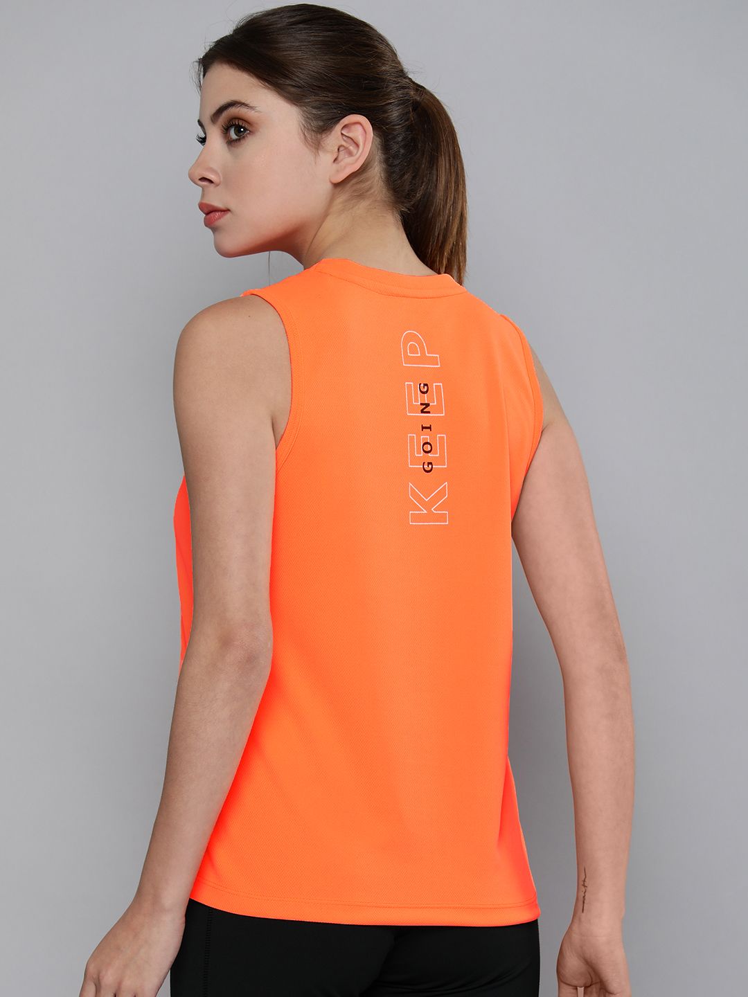 HRX By Hrithik Roshan Training Women Neon Orange Rapid-Dry Solid Tops Price in India