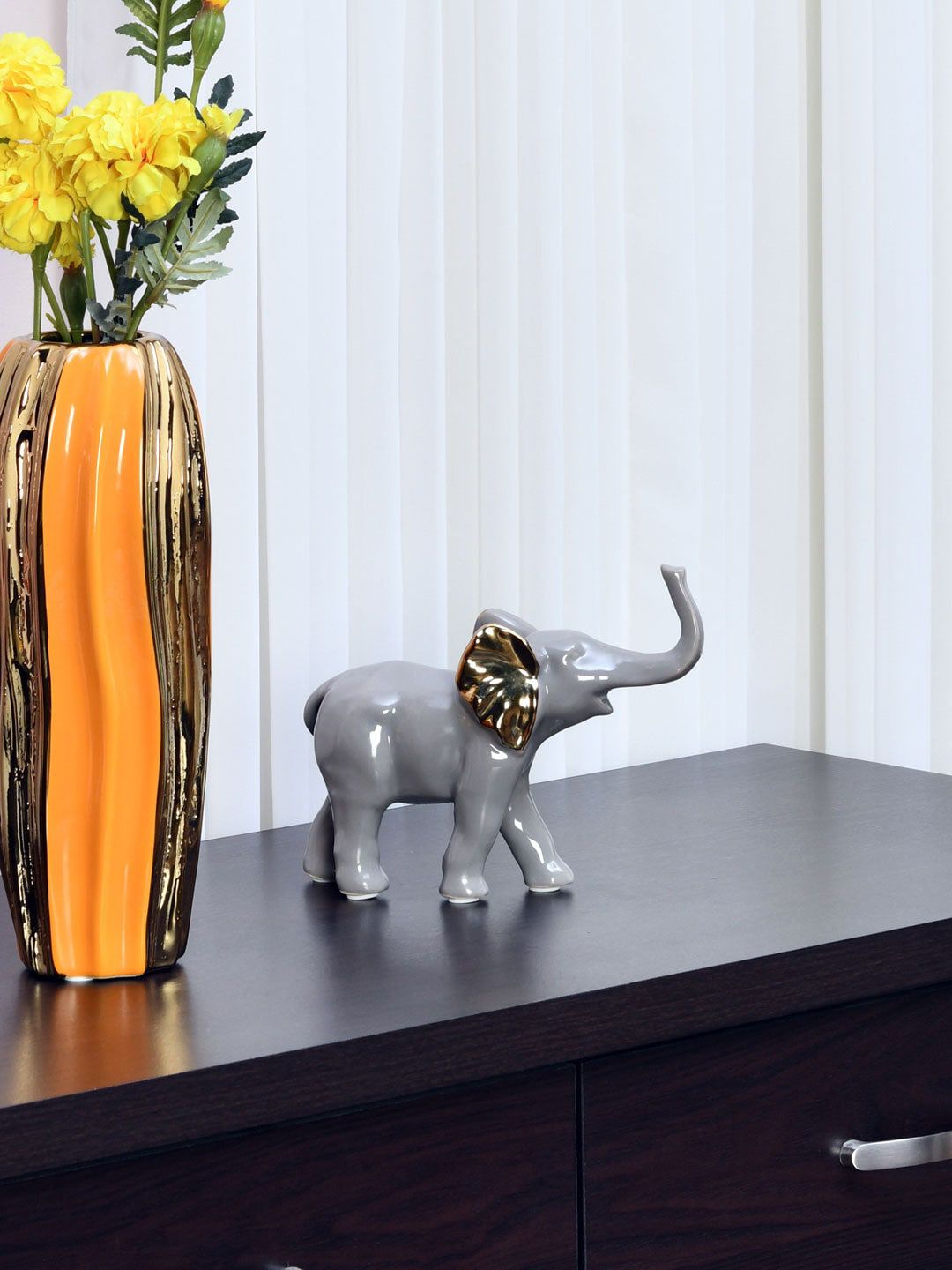 Athome by Nilkamal Grey Gold-Coloured Elephant Walking Showpiece Price in India