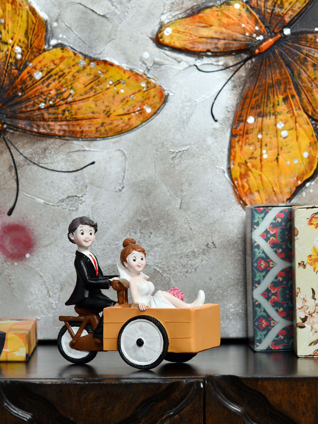 Athome by Nilkamal Black & White Couple On Cart Figurine Showpiece Price in India
