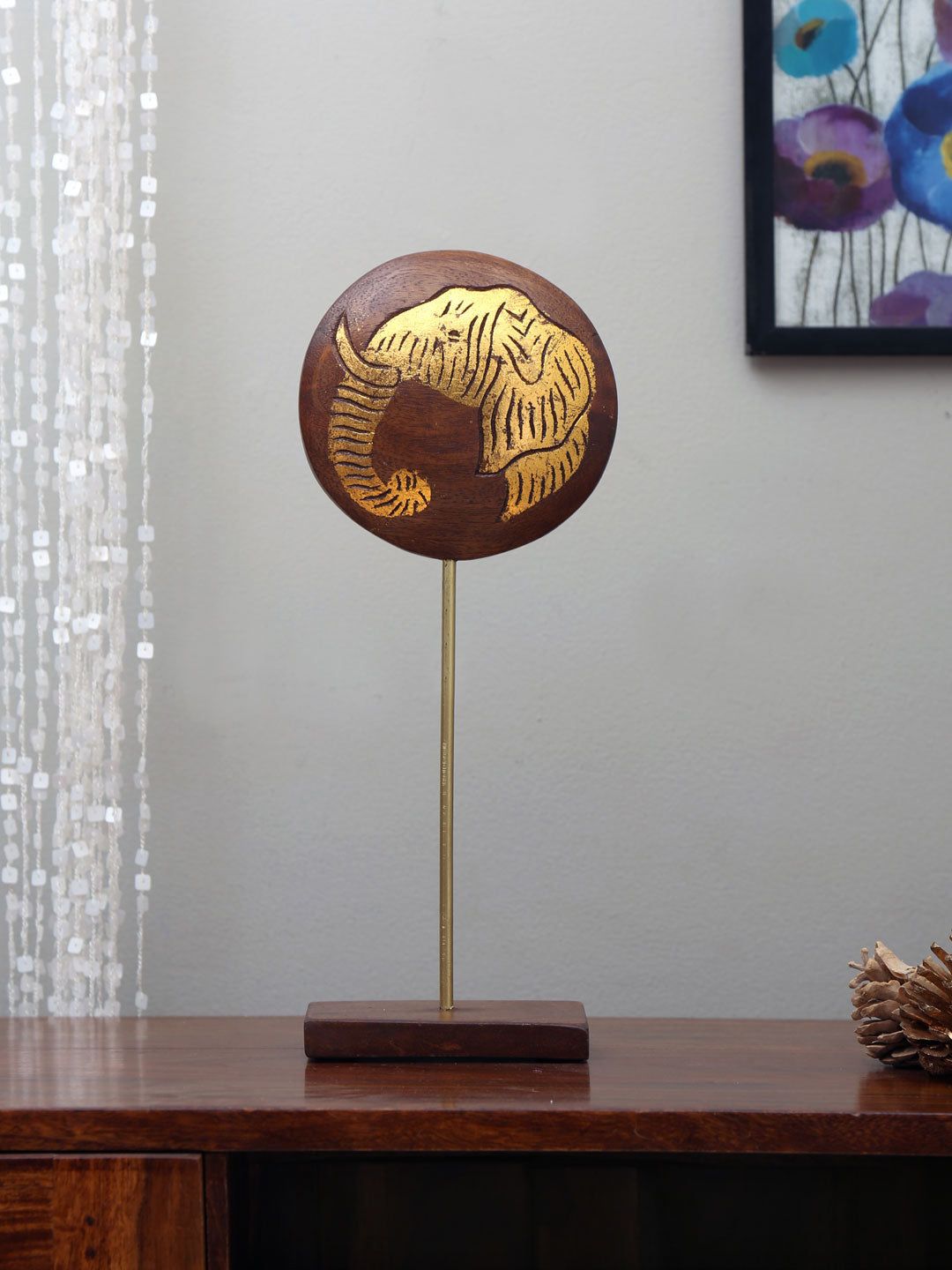 Athome by Nilkamal Gold-Toned & Brown Textured Elephant Face On Stand Showpiece Price in India