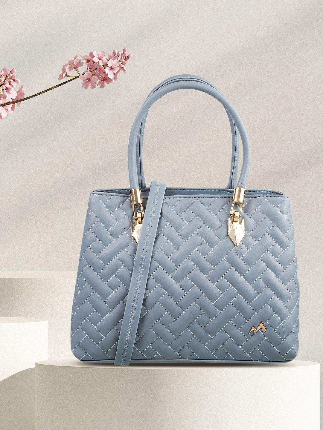 Metro Women Blue Textured Structured Handheld Bag with Quilted Price in India