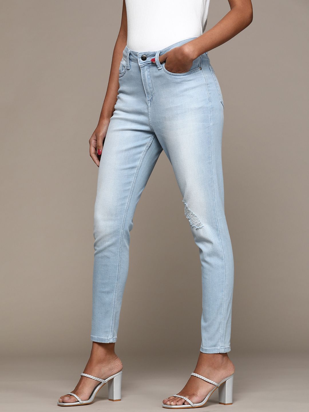bebe Women Light Indigo Denim Daze Super Skinny Fit High-Rise Mildly Distressed Jeans Price in India