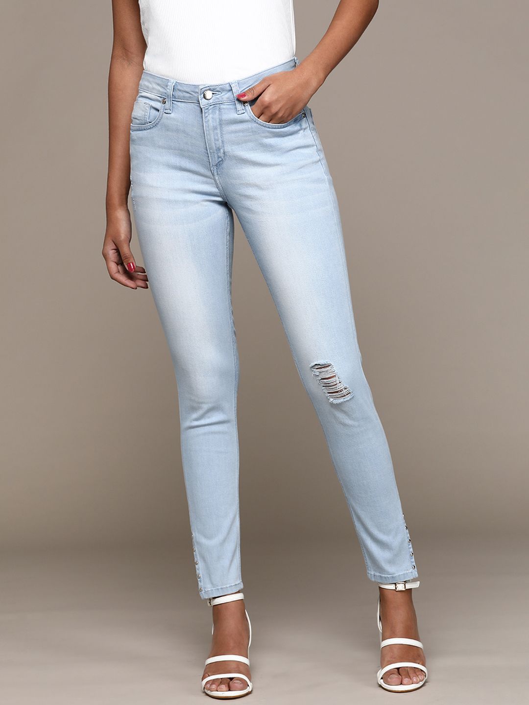 bebe Women Light Indigo Denim Daze Super Skinny Fit High-Rise Low Distress Jeans Price in India