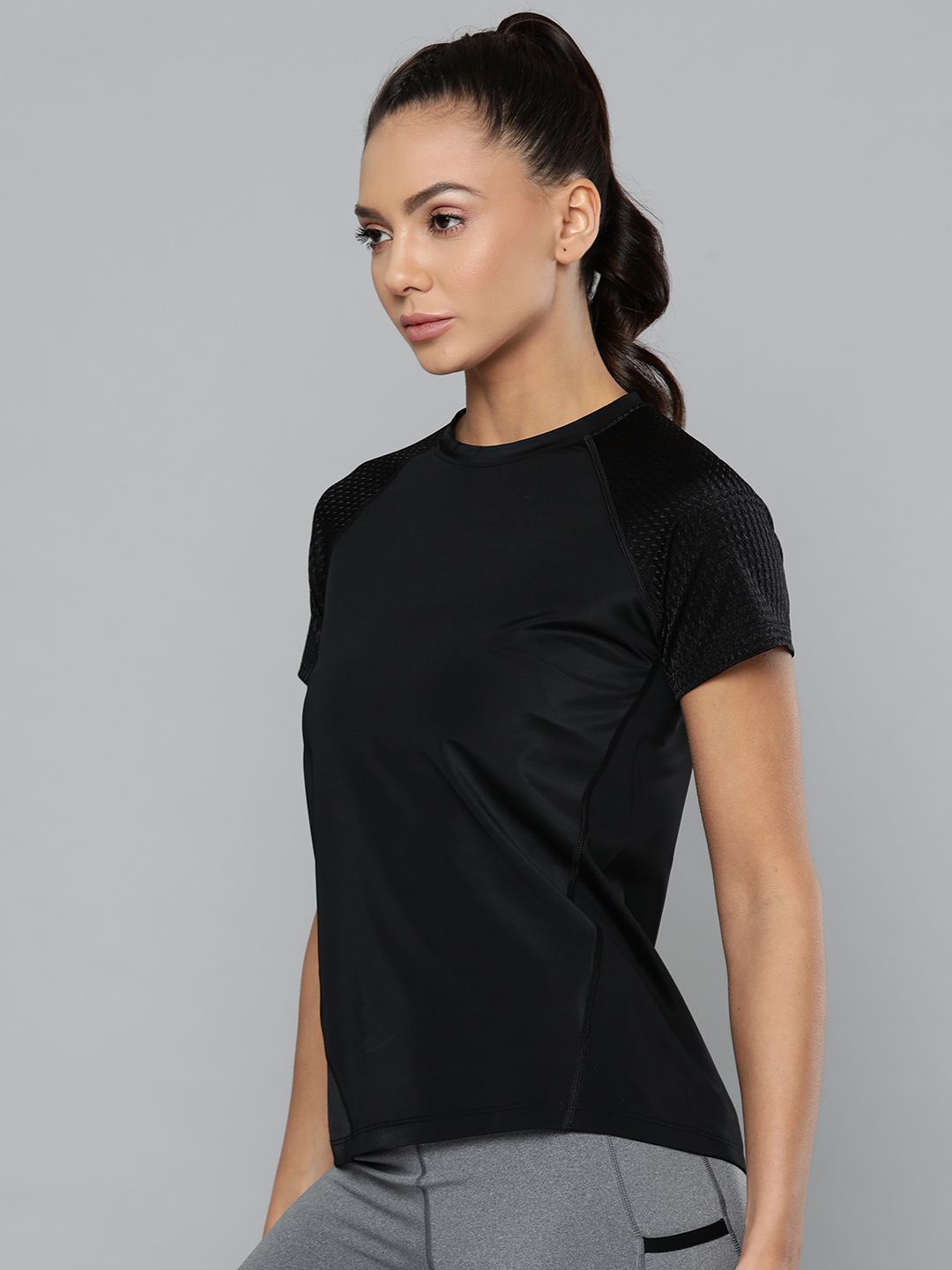 Fitkin Women Black Training or Gym Solid T-shirt Price in India