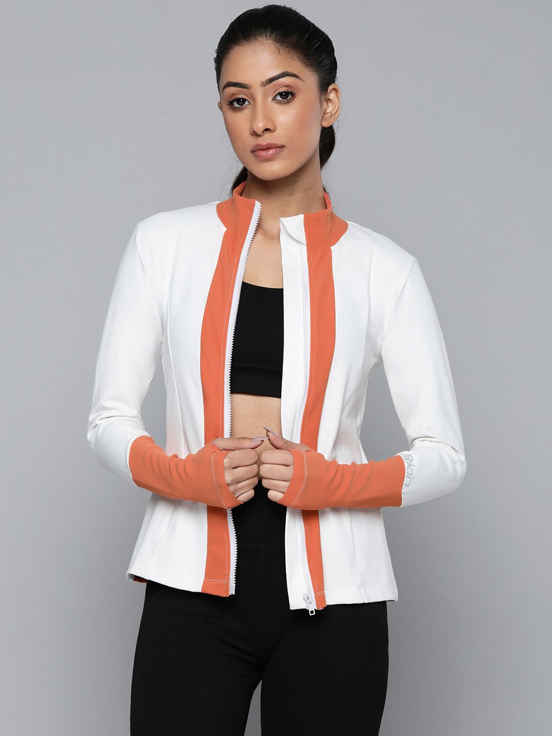 Fitkin Women White & Orange Training or Gym Sporty Jacket Price in India