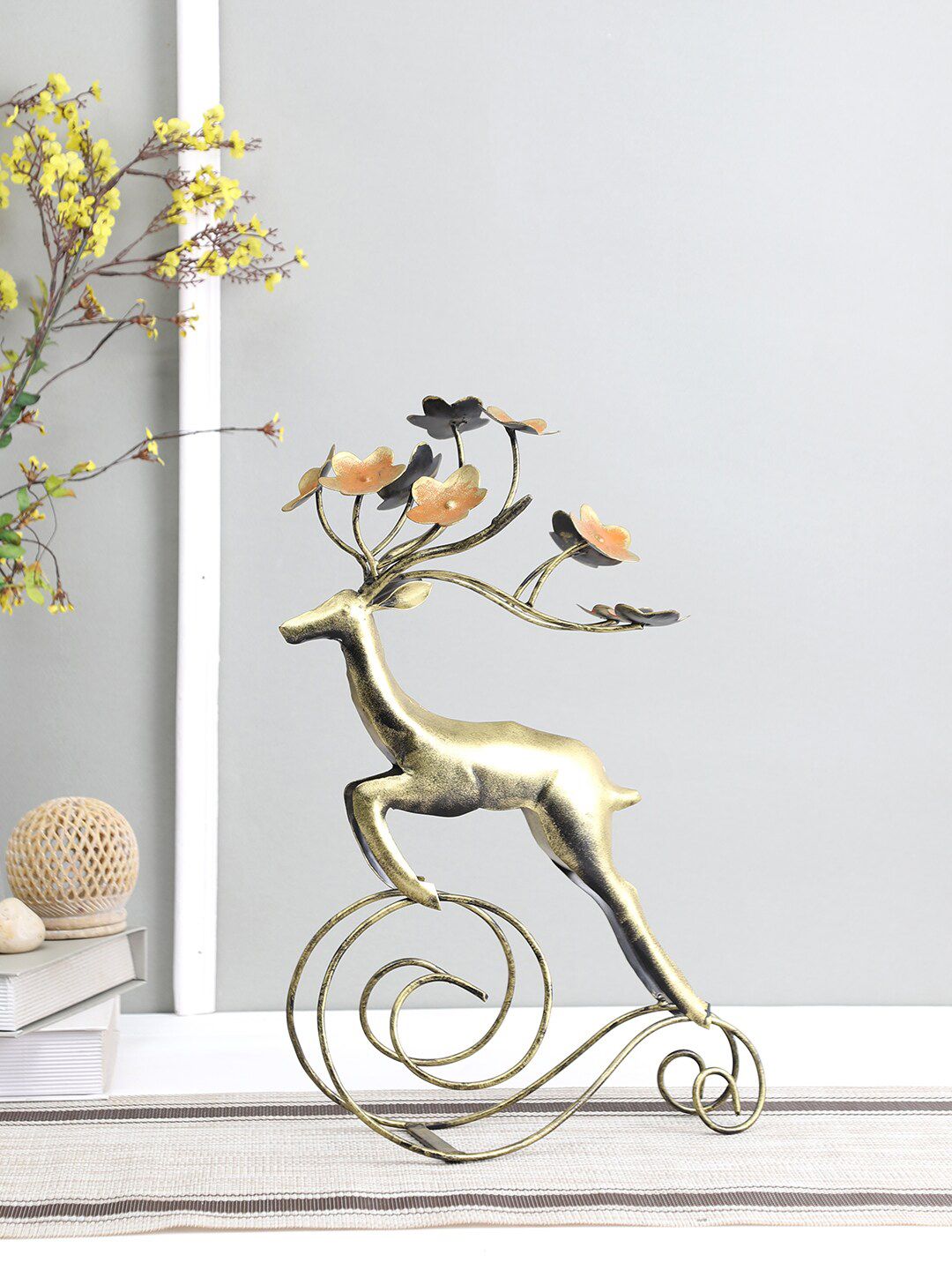 Aapno Rajasthan Gold-Toned Decorative Reindeer With Flower Showpieces Price in India