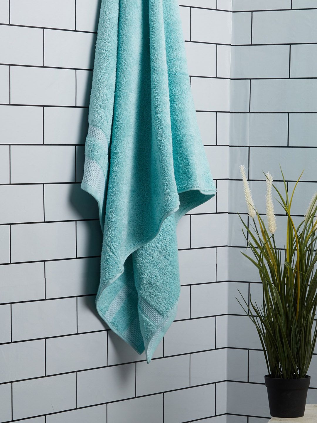 SPACES Turquoise Blue Solid Ultra Absorbency 600GSM Organic Cotton Bath Towel Price in India