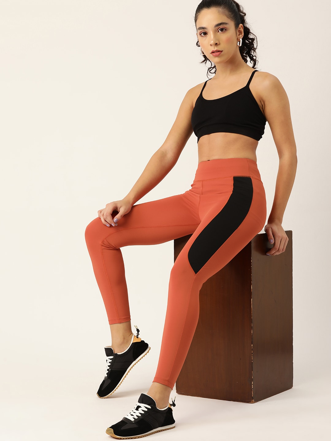 DressBerry Women Rust Orange & Black Colorblocked Sports Tights Price in India