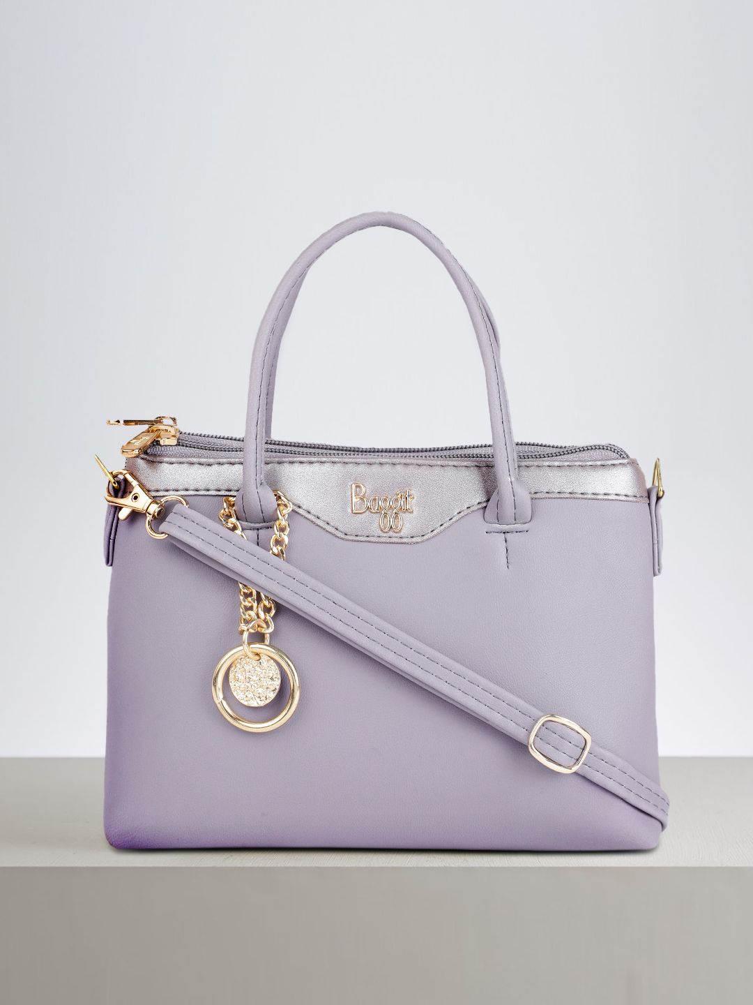 Baggit Violet Solid Regular Structured Handheld Bag with Tasselled Detail Price in India