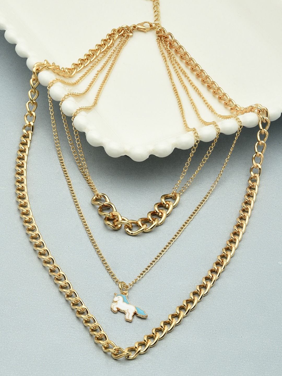 AMI Gold-Toned & Gold-Plated 3 Layered Contemporary Enamel Unicorn Charm Chain Price in India