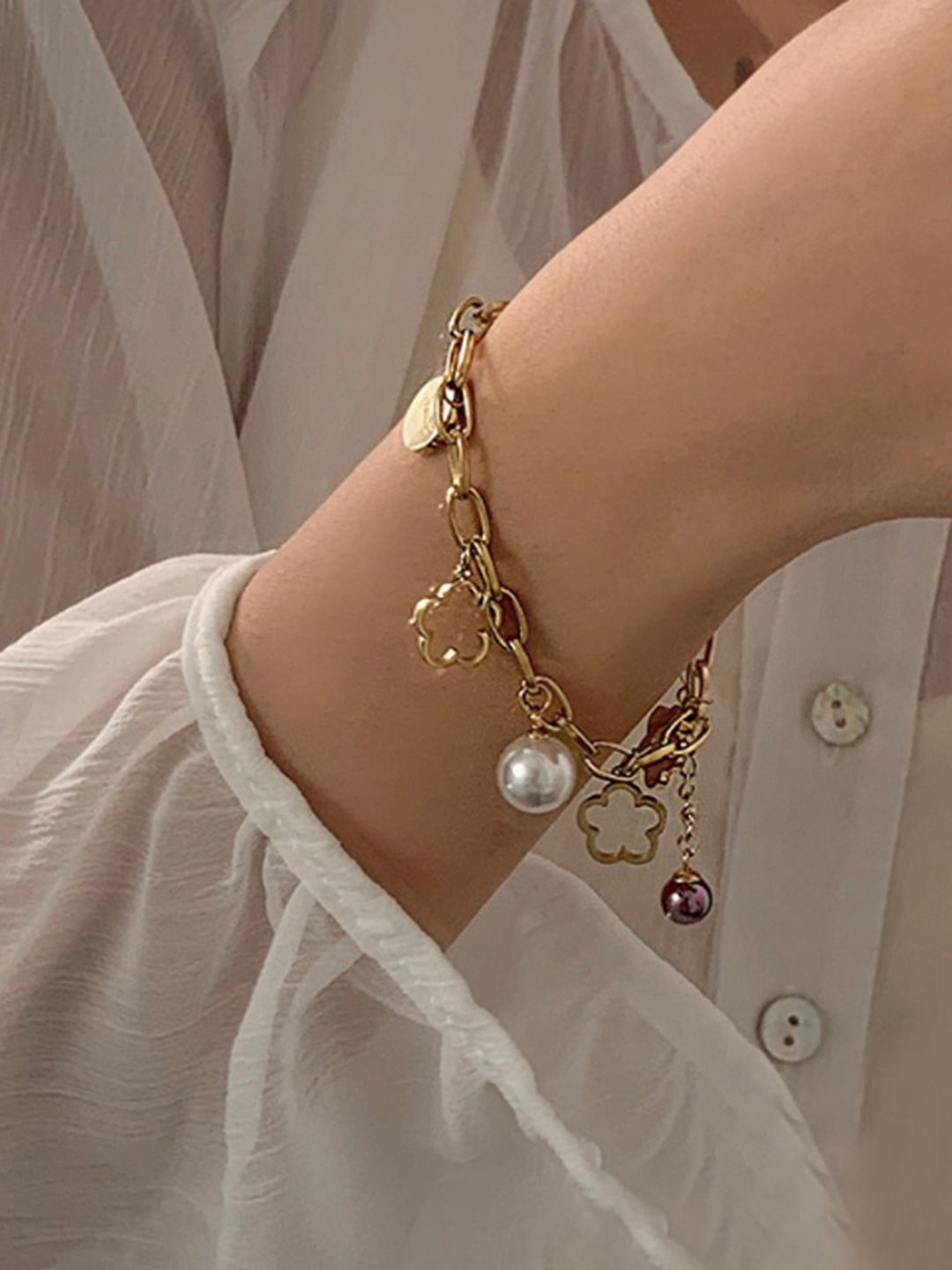 WHITE LIES Women Gold-Toned & White Pearls Gold-Plated Charm Bracelet Price in India