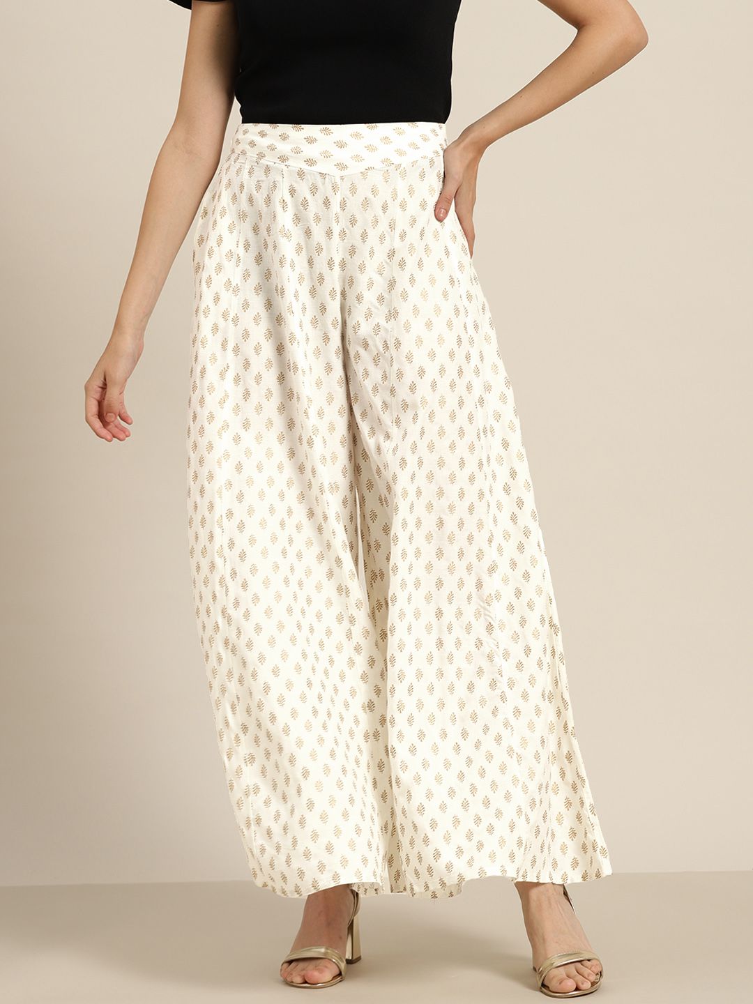 Juniper Women White & Golden Ethnic Motifs Printed Flared Knitted Ethnic Palazzos Price in India