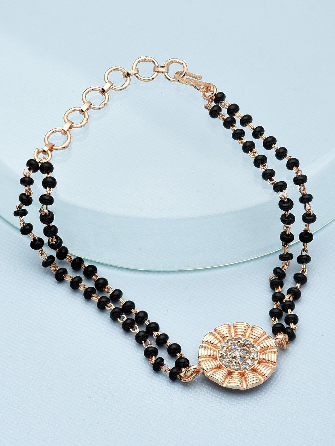 Zaveri Pearls Women Rose Gold-Plated & Black Brass Cubic Zirconia Mangalsutra Bracelet Price in India