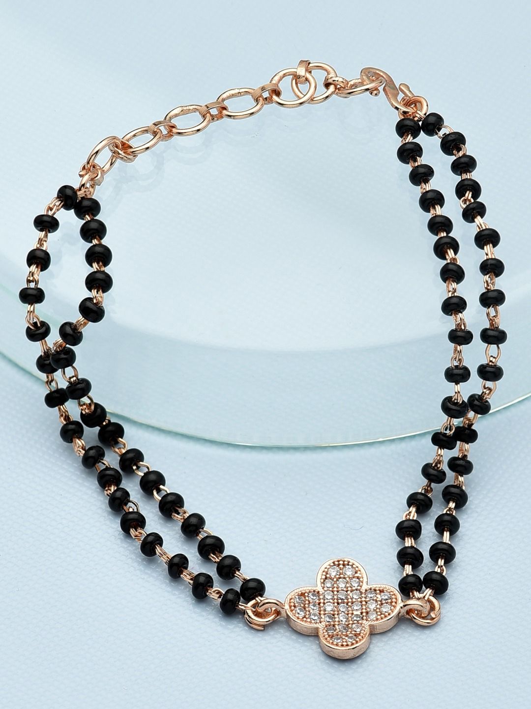 Zaveri Pearls Women Black & Rose Gold Brass Cubic Zirconia Rose Gold-Plated Link Bracelet Price in India