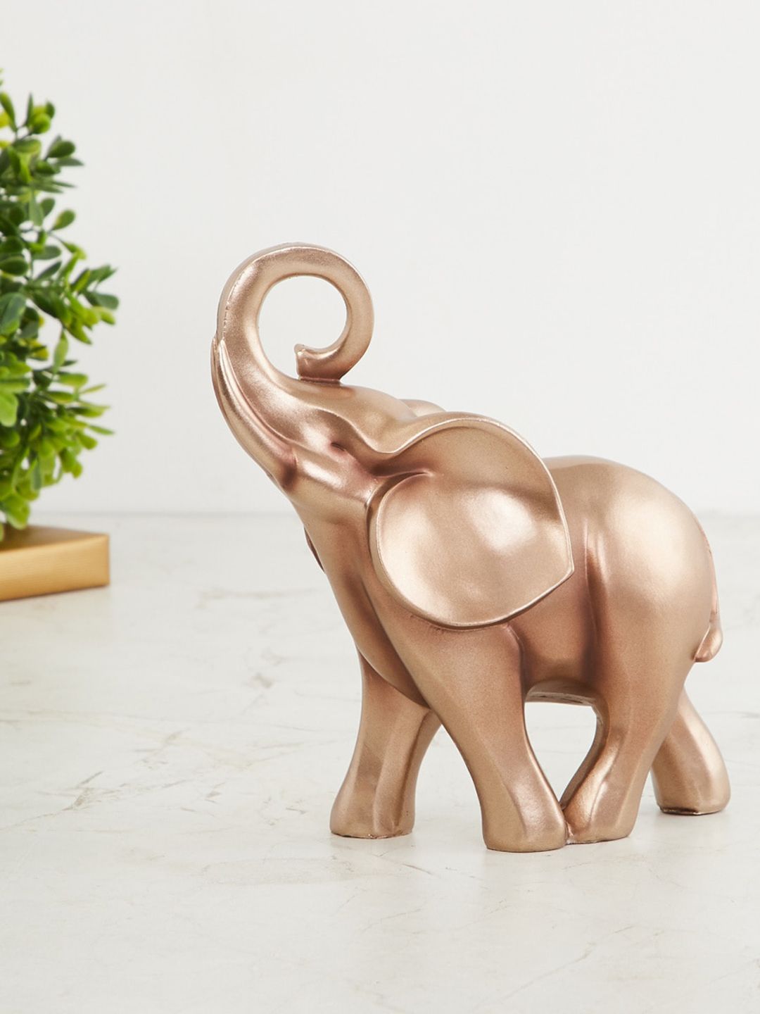 Home Centre Gold-Toned Round Trunk Elephant Figurine Showpiece Price in India