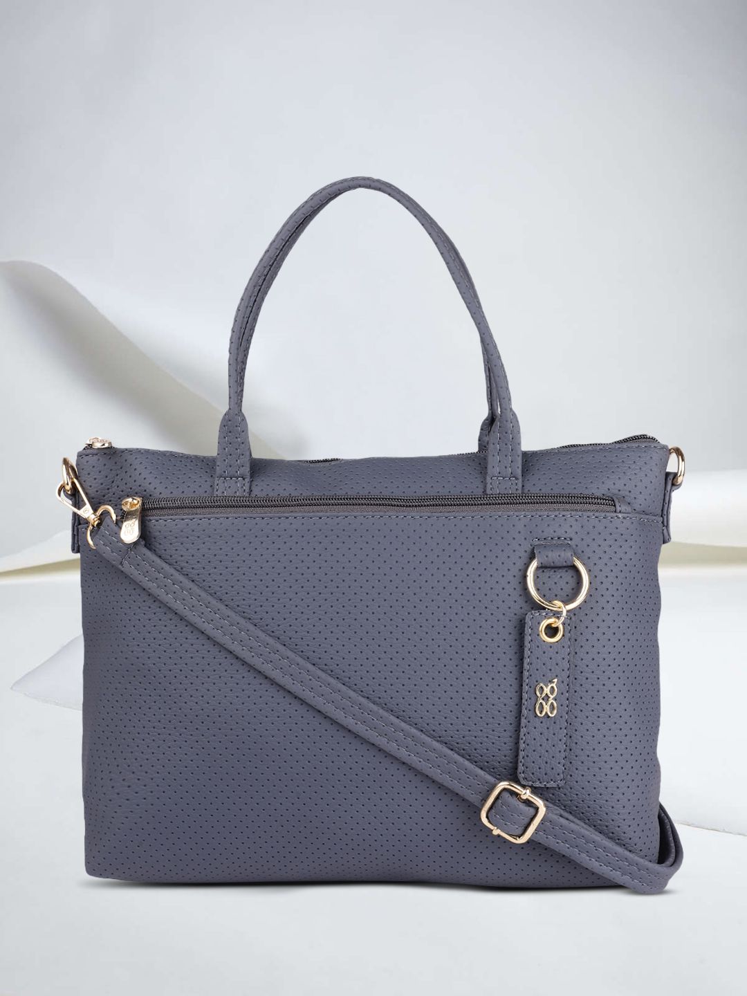 Baggit Women Blue Textured Handheld Bag Price in India