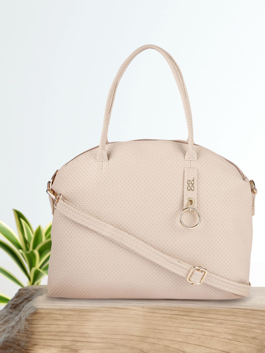 Baggit Women Beige Textured Handheld Bag Price in India