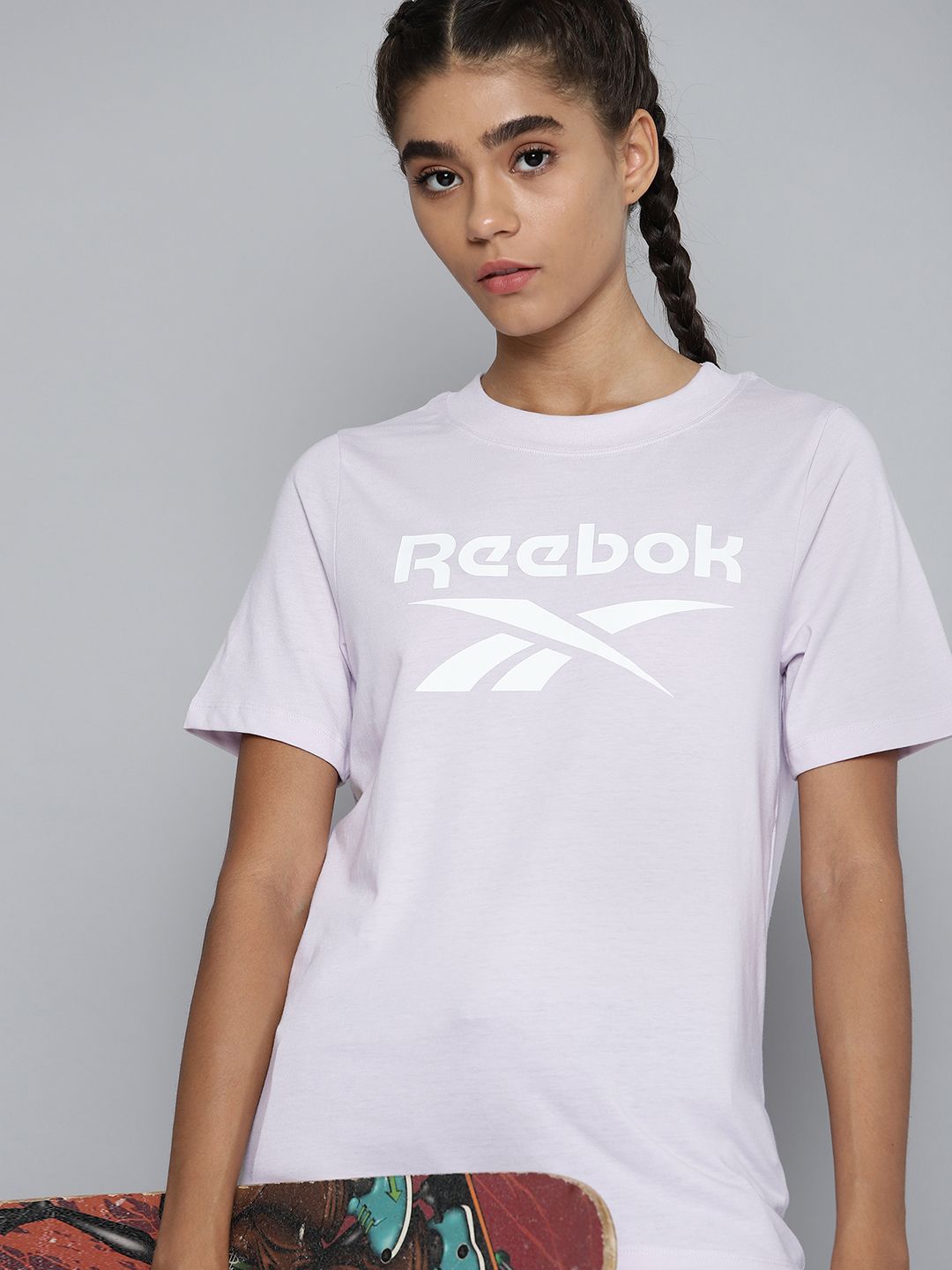 Reebok Women Lavender Brand Logo Printed Training or Gym T-shirt Price in India