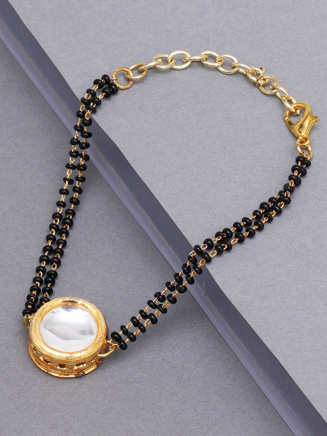 KARATCART Women Gold & Black Kundan Handcrafted Charm Bracelet Price in India